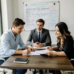 Co-parenting mediation discussion at a round table with a neutral mediator